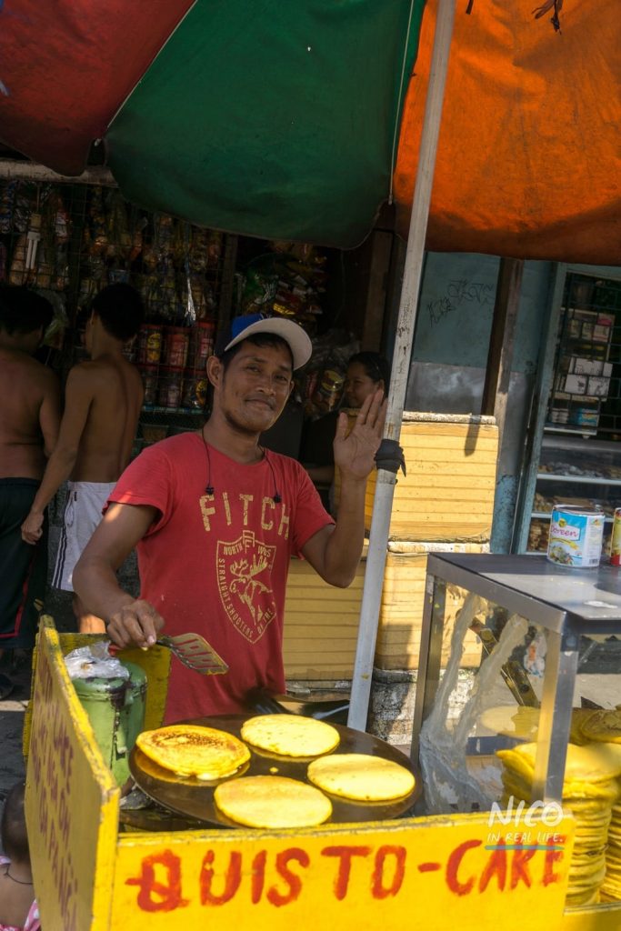 Man selling pancakes in Happyland (Manila, Philippines)